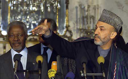 Karzai sworn in as head of interim government